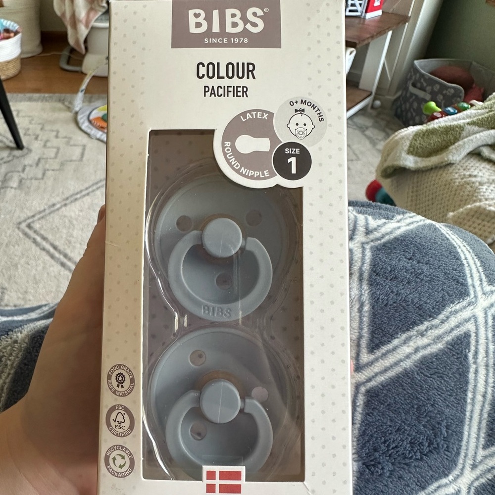 2 blue bibs pacifiers